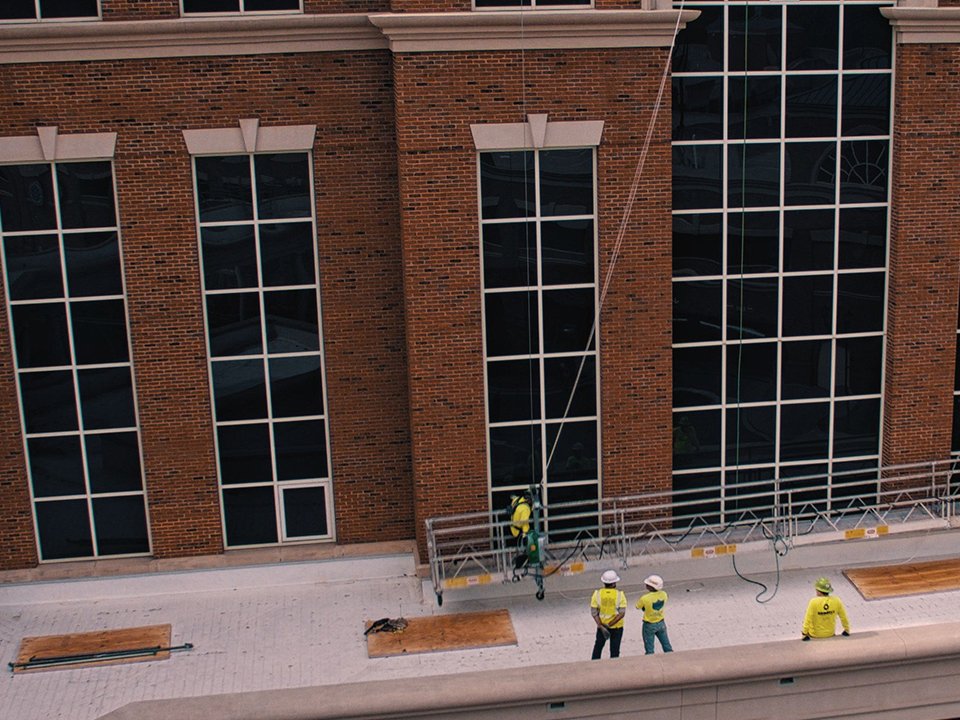 Nance Construction maintenance team repairing commercial facade